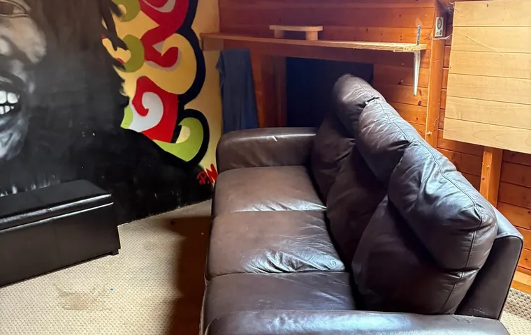 An attic room with an old sofa, before the clear-out