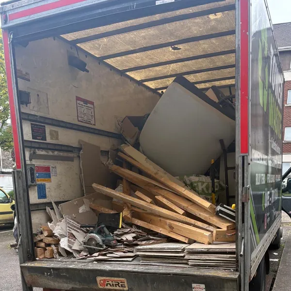 Timber and boards loaded in the back of the van, tail lift down
