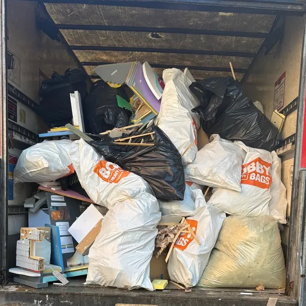 Bulk bags and rubbish bags loaded in the back of the van