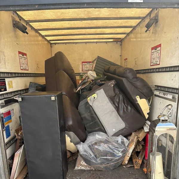 Furniture from an attic clear-out loaded in the van