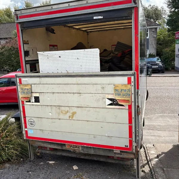 The van at the kerb, loaded after a shed clear-out