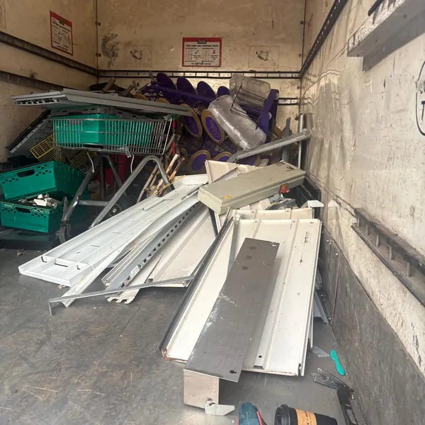 Shelving and crates from a commercial clear-out loaded in the van